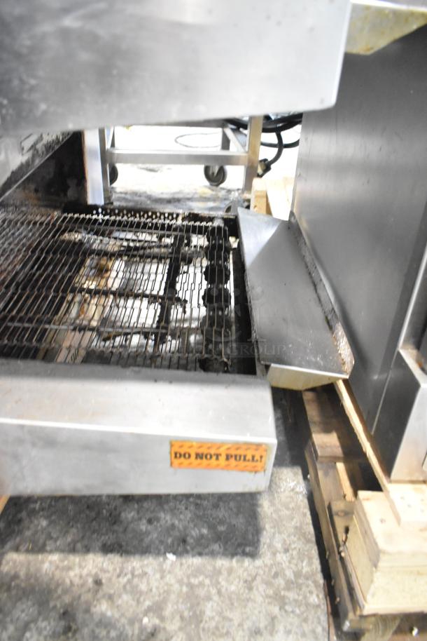Middleby Marshall DZ33T stainless steel conveyor pizza oven on casters, 208V, showing conveyor and "Do Not Pull" warning label.
