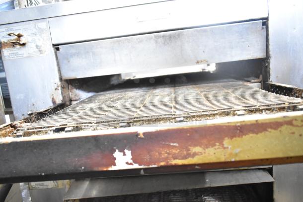 2021 Middleby Marshall CTX DZ33T stainless steel conveyor pizza oven, electric-powered, shown on commercial casters, used condition.