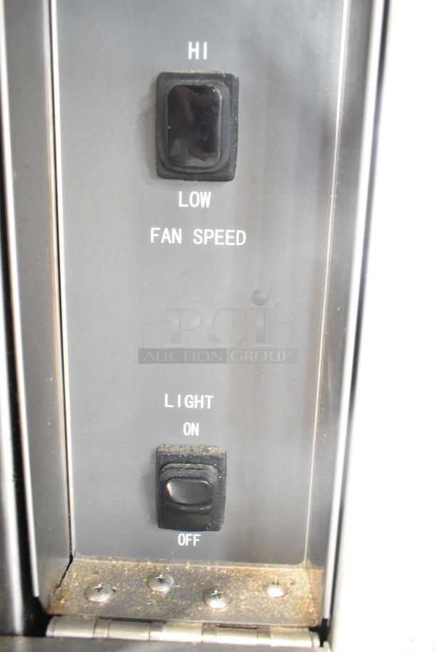 Control panel of Mainstreet 541CG1N convection oven, featuring fan speed and light switches. New condition, scratch and dent.