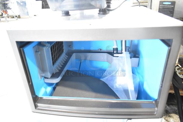 BRAND NEW Manitowoc UDP0065A-161 ice machine, 31 lb. bin, 62 lb. capacity, 115V, commercial use, interior view.