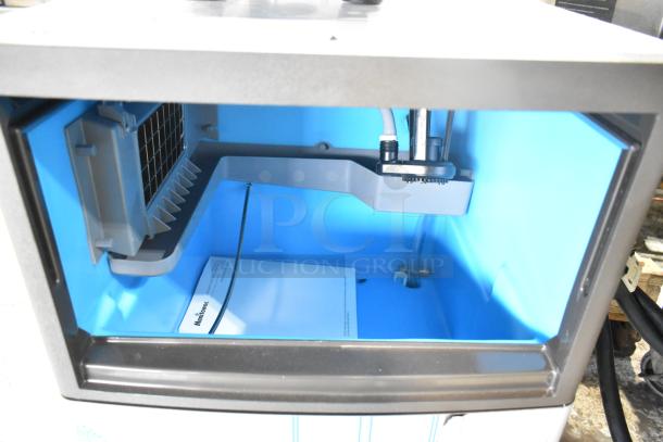 Brand new Manitowoc UDP0065A-161 undercounter ice machine, interior view, 31 lb bin, 62 lb capacity, 115V, 1 phase.