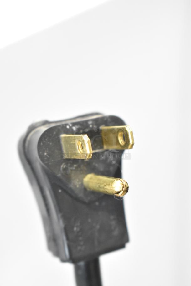 Close-up image of a three-prong electrical plug for the Habco SE12 Commercial Single Door Reach In Cooler.