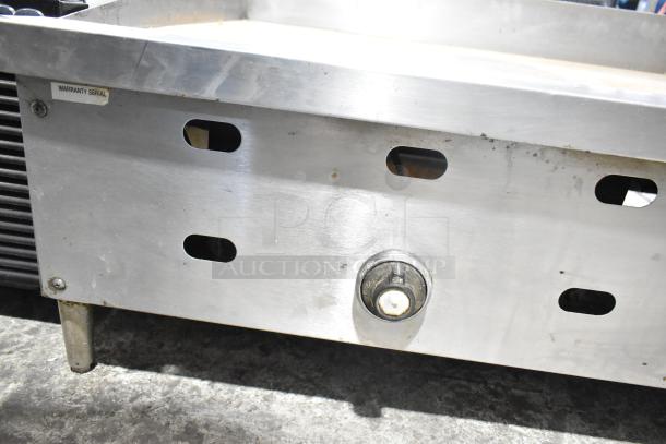 US Range Commercial Gas Griddle, stainless steel, countertop model, visible control knob, good condition with serial tag.