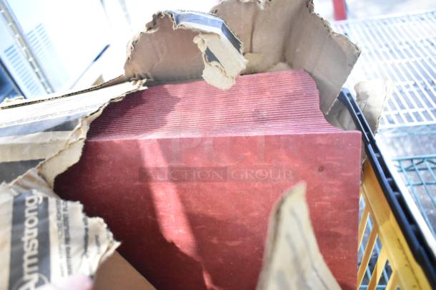 Two-tiered lot of various items including red textured panels, cardboard packaging, and visible wear. Auction item features signs, glasses, and parts, highlighting Central 0331-L1/2 Self Close Straight Stop. Item in used condition.