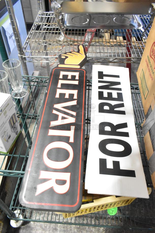 Two metal signs, one labeled "ELEVATOR" and one "FOR RENT," on a wire shelf with glassware and Central 0331-L1/2 parts.