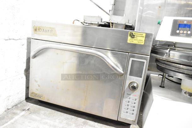 Amana AXP20 commercial rapid cook oven, stainless steel, visible wear, keypad interface, labeled "Loaner", operates on 208/230V.