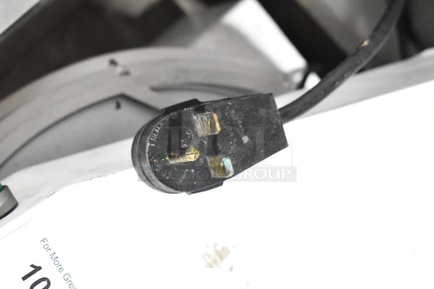 Proluxe Commercial Countertop Dough Press plug, showing three-prong electrical connector and part of the machine.