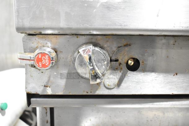 Southbend commercial gas range control panel, showing main gas on/off valve, stainless steel, moderate wear visible.