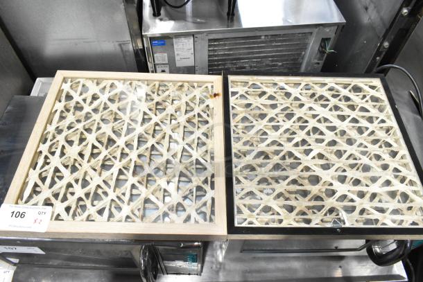 Two decorative framed lattice panels with geometric design, varying frame colors. Auction label indicates doubling your bid.