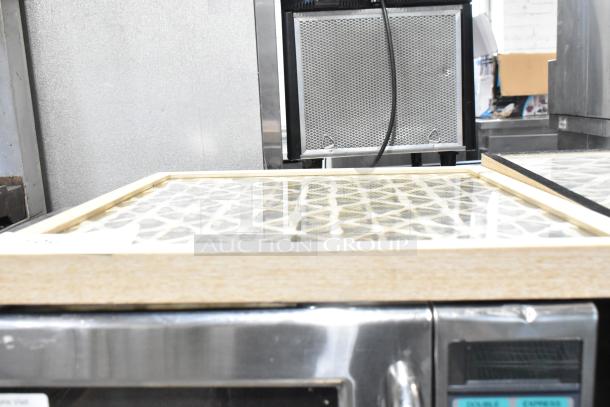 Two framed pictures with geometric patterns, light wood frames, new condition. Auction item doubles bid value.