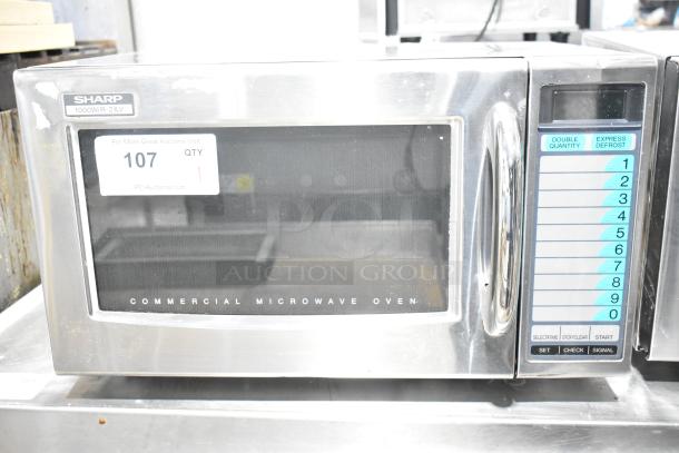 2022 Sharp R-21LVF Commercial Microwave Oven, stainless steel, 1000W, 120V, keypad controls, model label visible.