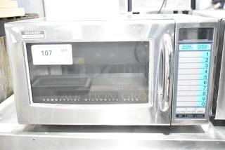 2022 Sharp R-21LVF Commercial Microwave Oven, stainless steel, 1000W, 120V, keypad controls, model label visible.