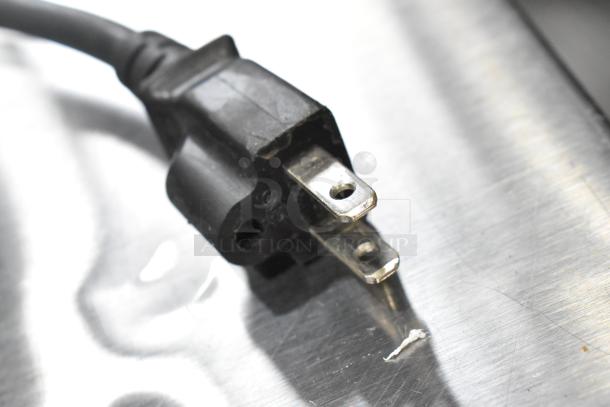 Close-up of power plug for Sharp R-21LVF commercial countertop microwave, 2023 model, 120 volts.