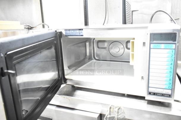 2023 Sharp R-21LVF commercial countertop microwave oven, open view. Features digital keypad, 120 volts, 1 phase.