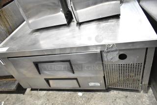 True Commercial 2 Drawer Chef Base with commercial casters, stainless steel, 115 volts, 1 phase, showing wear.