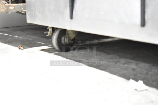 True Commercial 2 Drawer Chef Base with casters. Features 115 volts, 1 phase. Durable design, ideal for kitchens.