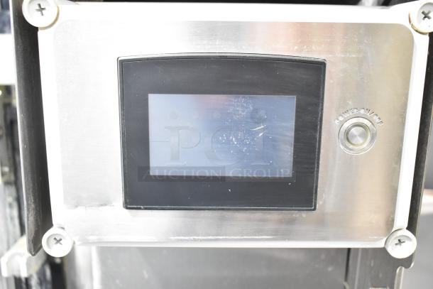 JBT 2ND-GEN-MFJ-HE citrus juicer control panel with a touchscreen and power button, in good condition.