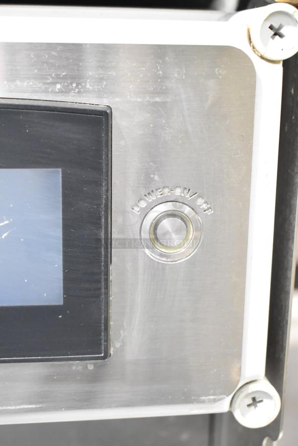 LATE MODEL JBT 2ND-GEN-MFJ-HE citrus juicer control panel showing power button. Stainless steel finish.