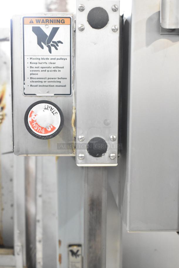 Hobart 6801 commercial meat saw with stainless steel finish, safety warnings, and push-button controls. 200-230V, 3-phase.