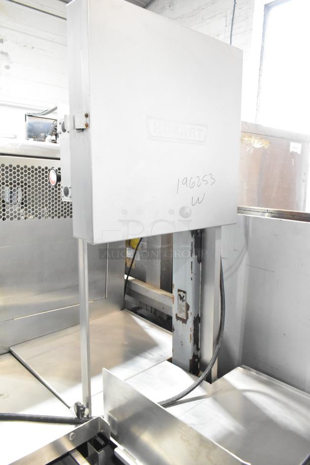 Hobart 6801 commercial meat saw, floor style, 200-230 volts, 3 phase, sturdy construction, minor markings visible.