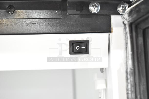 Close-up of the Habco SE18 cooler interior showing the power switch and surrounding components.