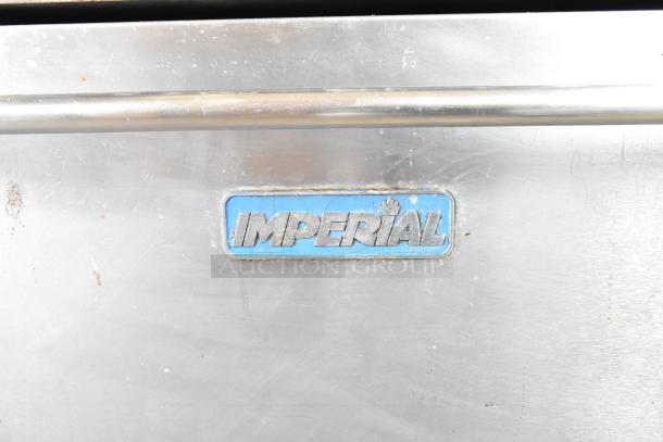Imperial Commercial 4 Burner Gas Range with griddle, oven, overshelf, and backsplash on casters. Visible Imperial logo.