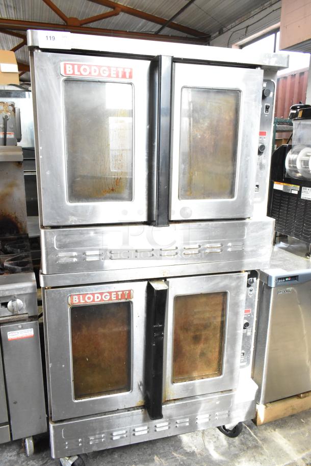 Pair of 2016 Blodgett DFG-100-3 full-size convection ovens with view-through doors, thermostatic controls, on casters.