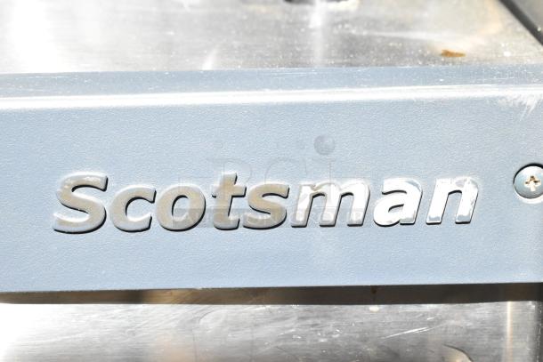 Scotsman Prodigy Commercial Ice Head with visible branding, in used condition, durable metal exterior.