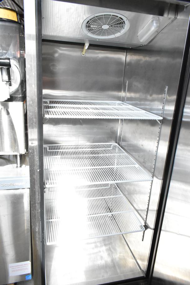 2017 Migali C-1R commercial cooler, single door, reach-in, on casters, 115V, 1 phase, with adjustable wire shelves.