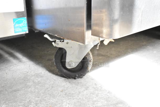 Migali C-1R commercial cooler on casters, 2017 model, Energy Star certified, 115 volts, 1 phase. Close-up of caster.