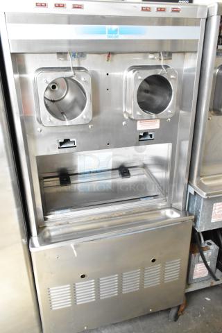 Taylor commercial 2-flavor frozen beverage machine, stainless steel, on casters, 208/240V, 1 phase. Good condition.
