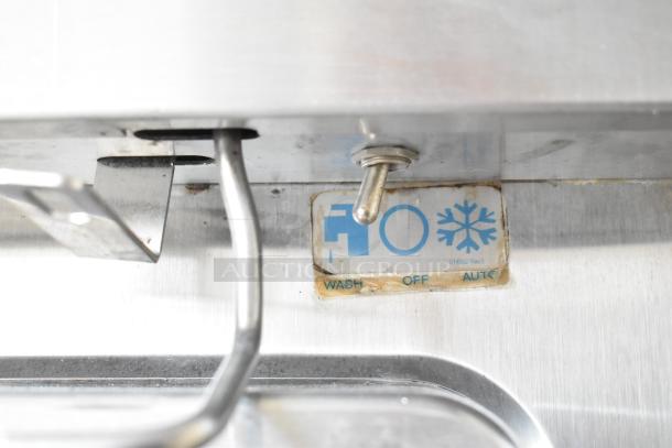 Taylor commercial frozen beverage machine, 2 flavor, stainless steel, 208/240 volts, 1 phase, control toggle switch visible.