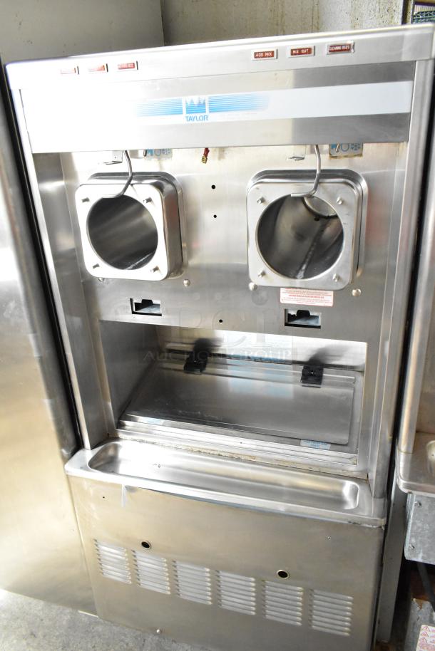 Taylor commercial floor-style 2 flavor frozen beverage machine on casters, stainless steel, 208/240V, 1 phase.