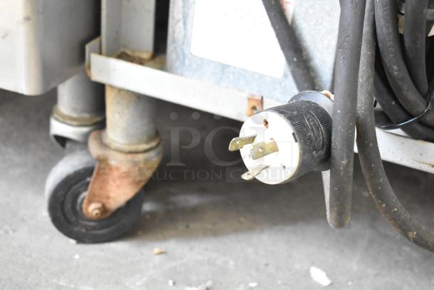 Taylor 342D-27 commercial frozen beverage machine, 2 flavor, on casters. 208/240V, 1 phase, visible power plug.