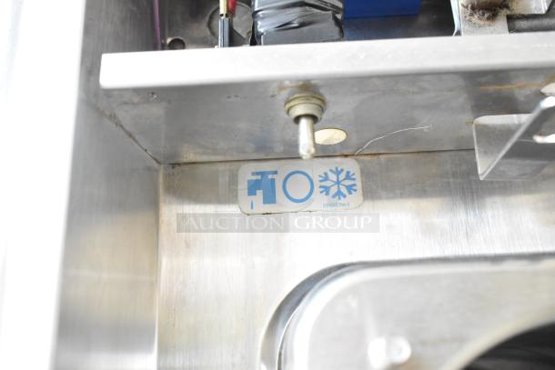 Taylor 342D-27 commercial frozen beverage machine, stainless steel, labels on interior, on commercial casters, 208/240V.