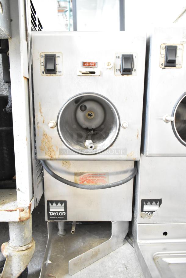 Taylor commercial countertop single flavor frozen beverage machine, 115 volts, 1 phase. Visible wear and rust on exterior.