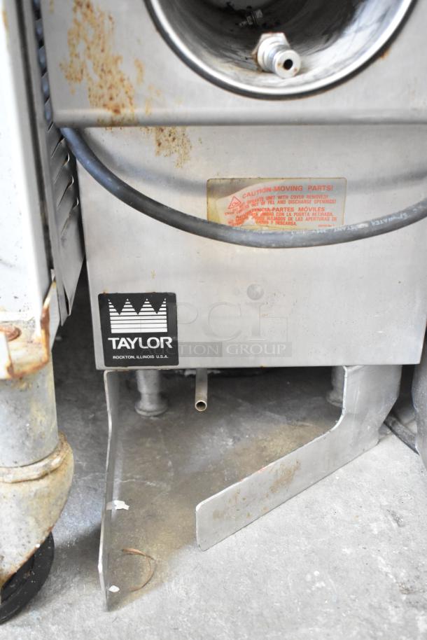 Taylor Commercial Countertop Single Flavor Frozen Beverage Machine, 115V, 1 Phase, with visible wear and logo.