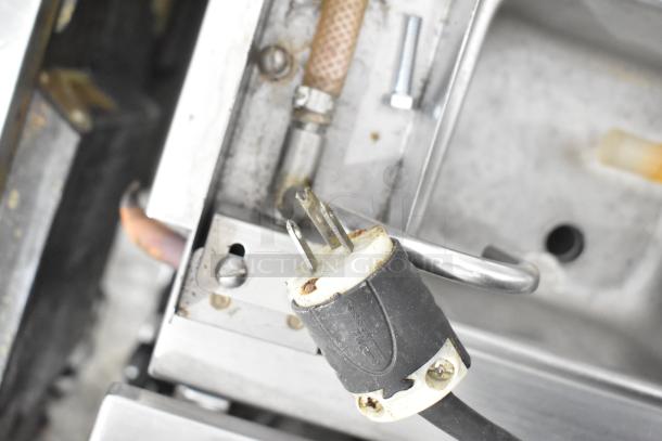 Taylor Commercial Countertop Single Flavor Frozen Beverage Machine power plug detail, showing wear. 115 Volts, 1 Phase.