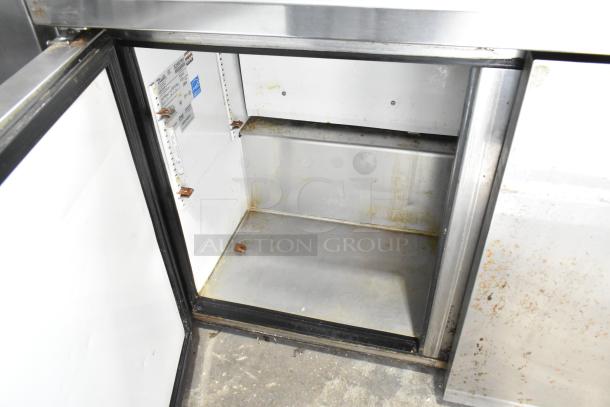 True TUC-48-LP commercial undercounter cooler, 2-door, stainless steel interior, model label visible, used condition.