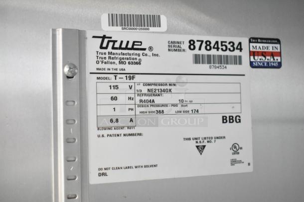 2016 True T-19F commercial freezer label showing model, voltage, refrigerant, and serial number. Made in the USA.