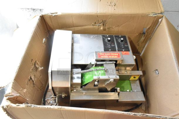 Teruisi YY-MY15 commercial vegetable cutter in a cardboard box, featuring control knobs and a label "Do not rinse with water."