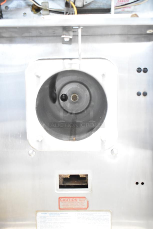 Taylor Commercial Single Flavor Frozen Beverage Machine, stainless steel, caution label visible, used condition.