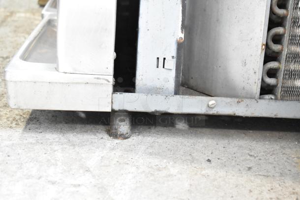 Taylor commercial countertop single-flavor frozen beverage machine base, showing metal construction and slight wear.