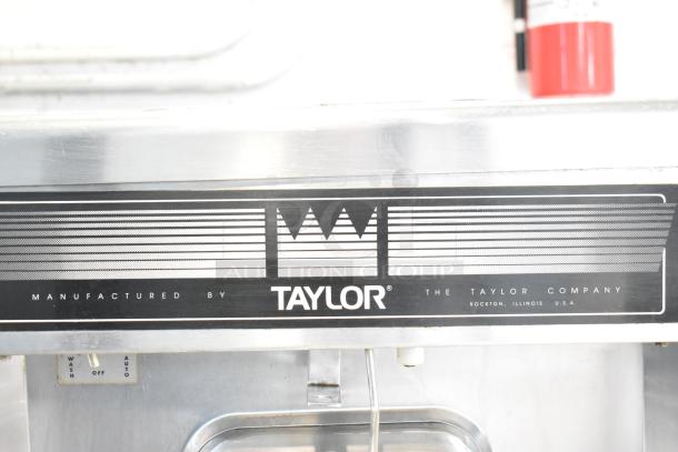 Taylor commercial countertop single flavor frozen beverage machine, stainless steel, with manufacturer branding visible.