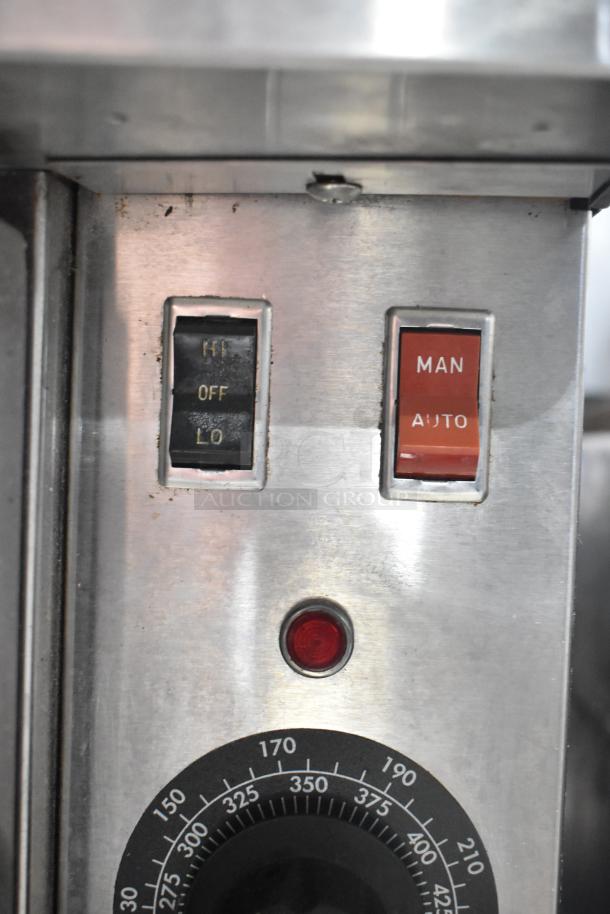 Blodgett commercial convection oven controls; switches labeled "HI/OFF/LO" and "MAN/AUTO"; includes temperature dial.