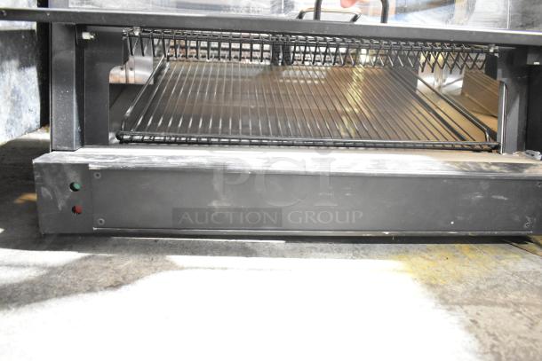 Nemco 6470-SPW Commercial 3-Tier Display Warmer with visible wire racks, black exterior, 120 volts, 1 phase.