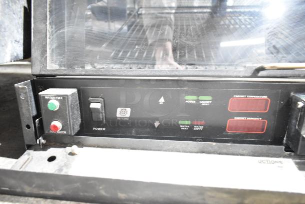 Nemco 6470-SPW Humidified Display Warmer interface, showing power and water control buttons with LED indicators.