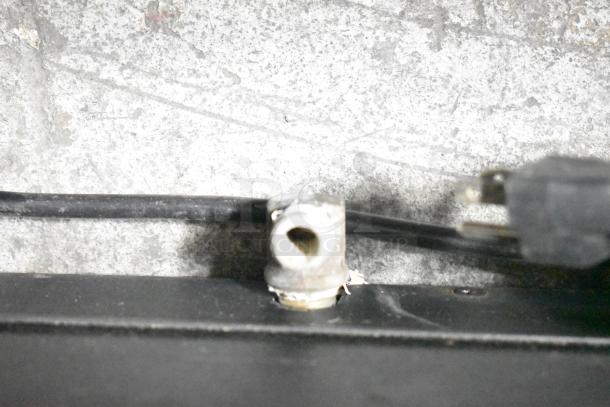 Image of a power cord and plug on a Nemco 6470-SPW Commercial Display Warmer. Cord appears intact.