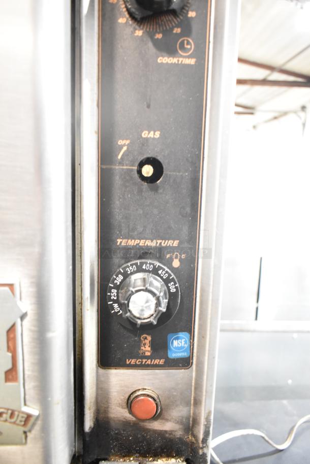 Montague commercial gas convection oven control panel with temperature and cook time dials, NSF certification visible.