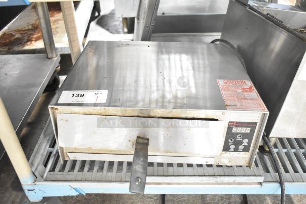 Wisco 425 Countertop Pizza Oven, 120 Volts, 1 Phase. Stainless steel exterior, digital display, visible caution label.